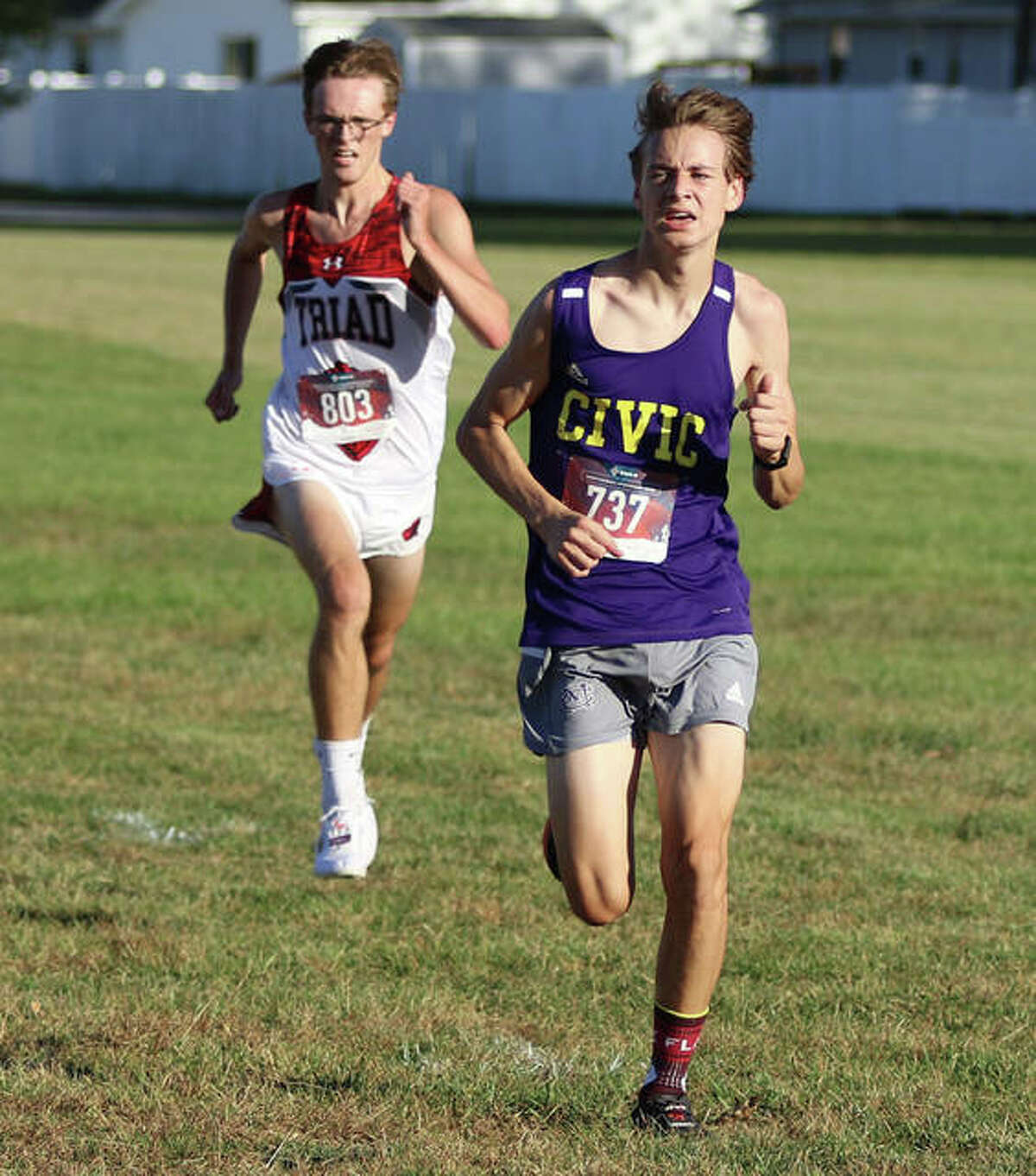 CM’s Jackson Collman (right) and Triad’s Ethan Dudley make their push to the finish of the MVC Meet on Tuesday in Mascoutah. Dudley finished ninth in the race, with Collman in 10th.