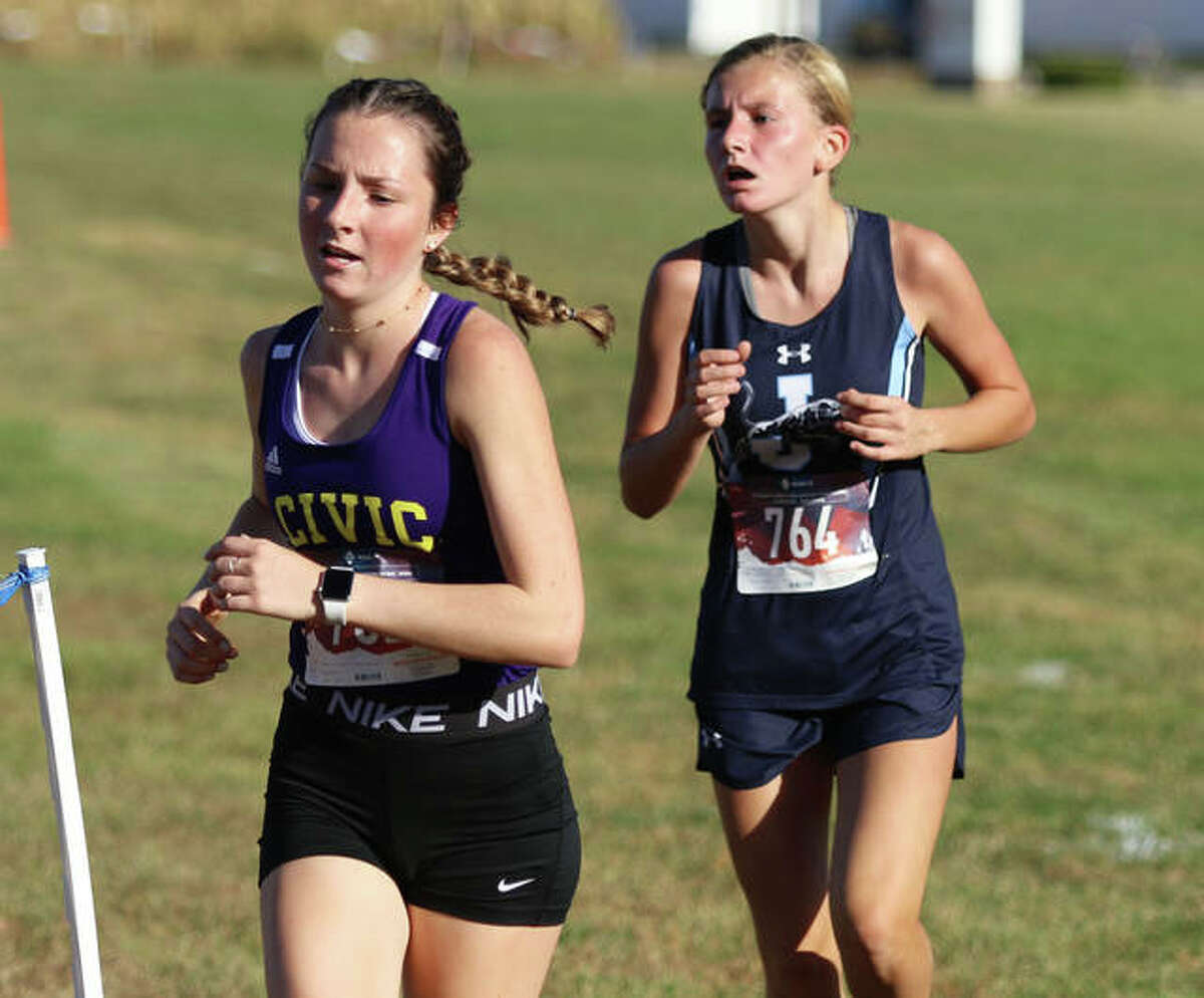 CM’s Alyssa Mann (left) and Jersey’s Abby Fraley approach the finish line Tuesday at the MVC Meet in Mascoutah.