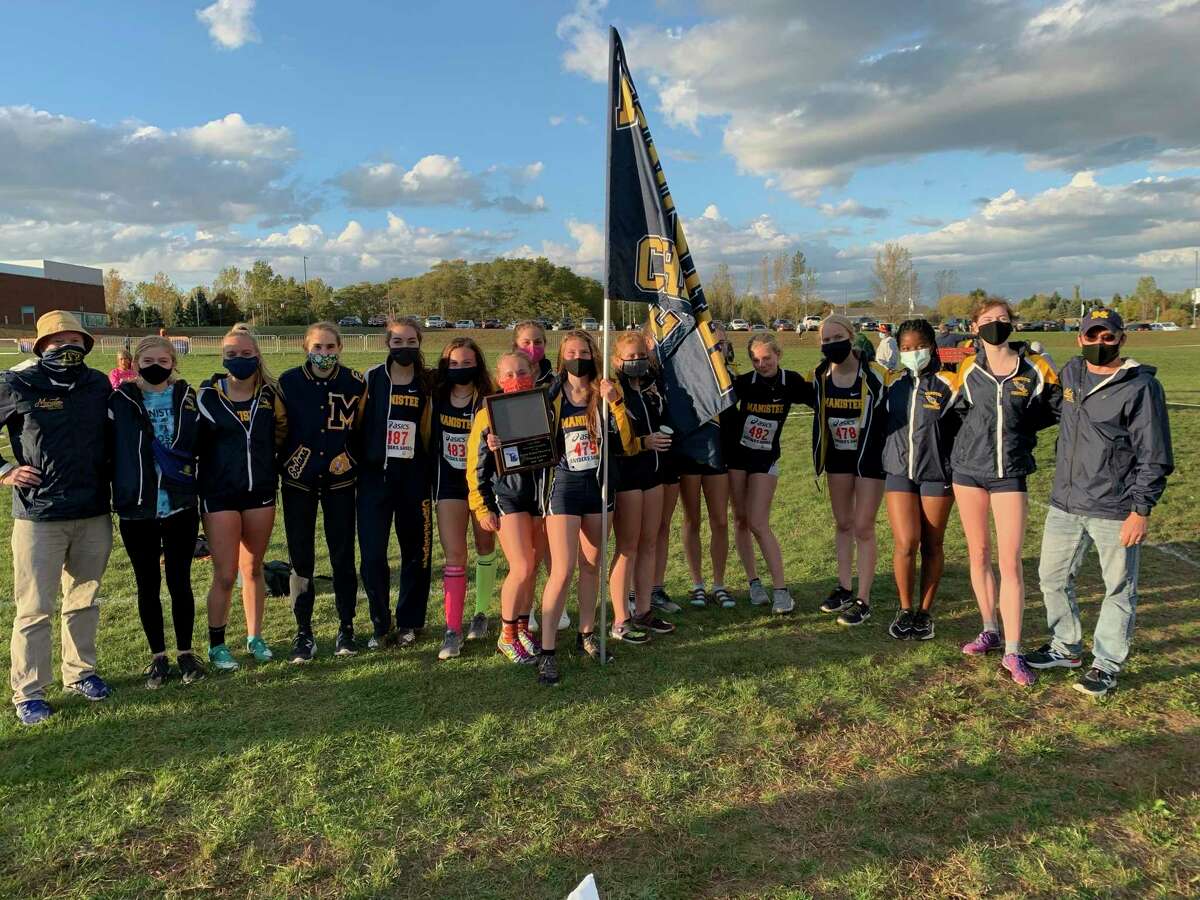 The Manistee girls celebrate the first-ever conference championship on Tuesday after winning their third Lakes 8 Conference jamboree this season. (Courtesy photo)