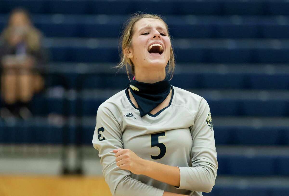 Lake Creek defensive specialist Reese Micklos (5) reacts after her team scores during the first set of a District 20-5A volleyball match at Lake Creek High School against Porter in Montgomery, Tuesday, Oct. 13, 2020.