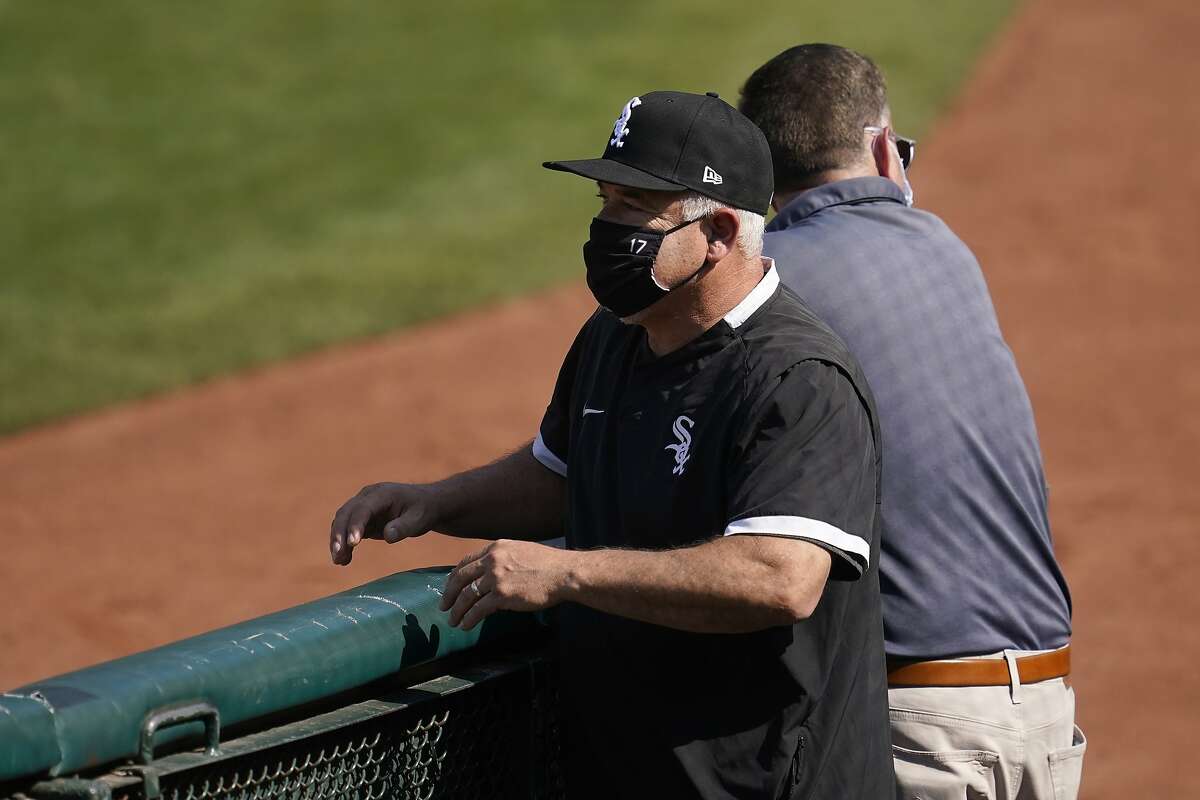 Chicago White Sox manager Rick Renteria watches as players practice during a baseball workout in Oakland, Calif., Monday, Sept. 28, 2020. The White Sox are scheduled to play the Oakland Athletics in an American League wild-card playoff series starting Tuesday. (AP Photo/Jeff Chiu)