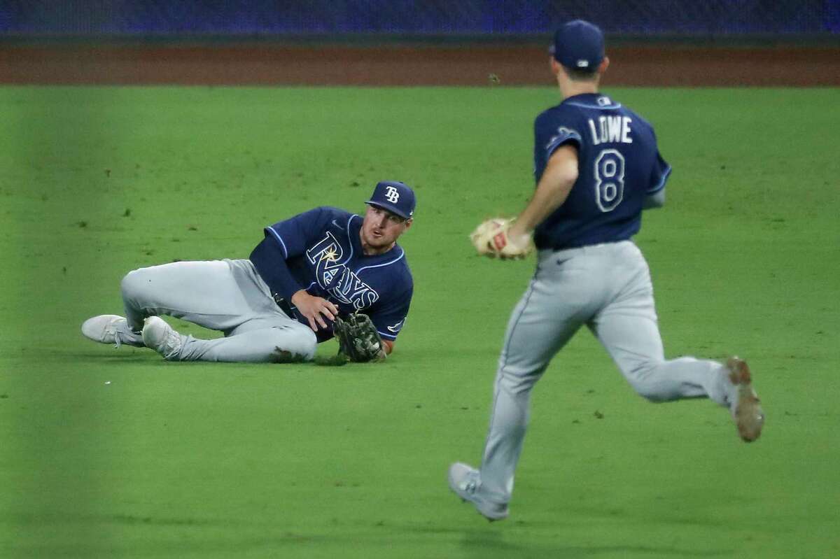 Tampa Bay Rays Hunter Renfroe comes up with a diving catch on ball hit by Houston Astros Kyle Tucker with the bases loaded for the second out of the eighth inning of Game 3 of the American League Championship Series at Petco Park Tuesday, Oct. 13, 2020, in San Diego.