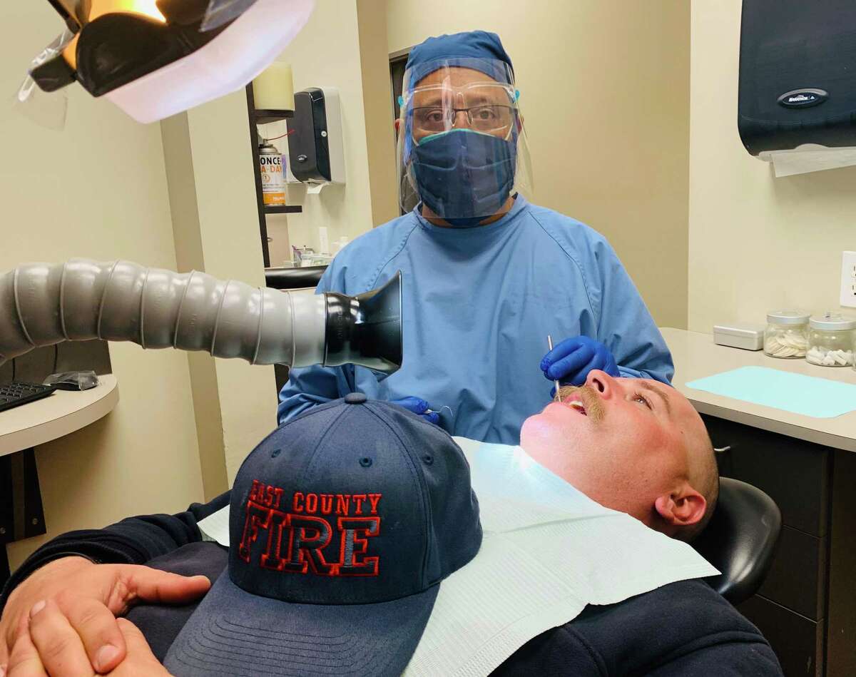 Recently, Porter Family Dentistry began offering free oral cancer screenings for firefighters in the county as a way to give back. The dental office plans on making it an annual tradition. Dr. Mustafa Yamani, pictured here, was inspired to help firefighters after seeing so many of them fly across the country to help put out fires in California, where he went to school.