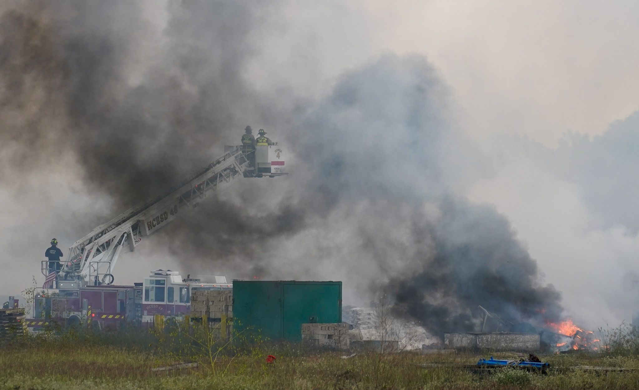 Firefighter hospitalized after massive fire erupts at Katy apartment
