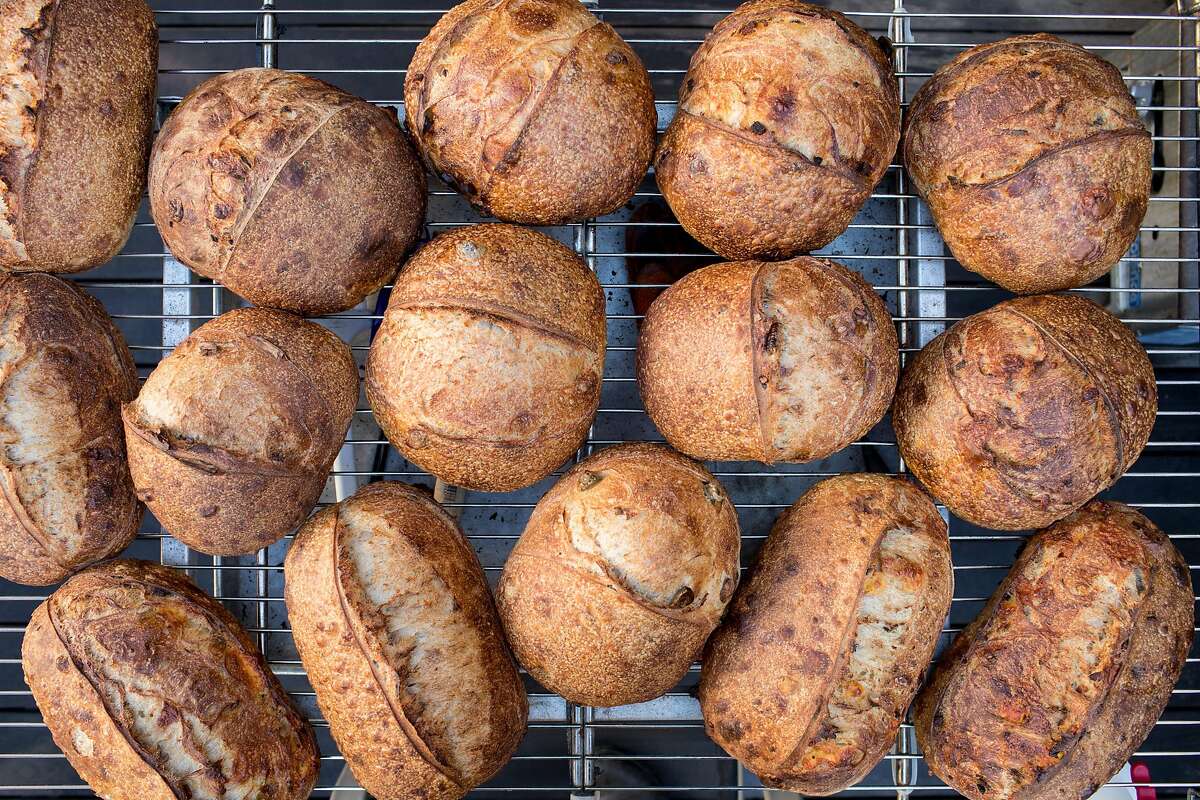 A fresh batch of Rize Up Sourdough loaves cool on a rack in Azikiwee Anderson’s backyard in San Francisco.
