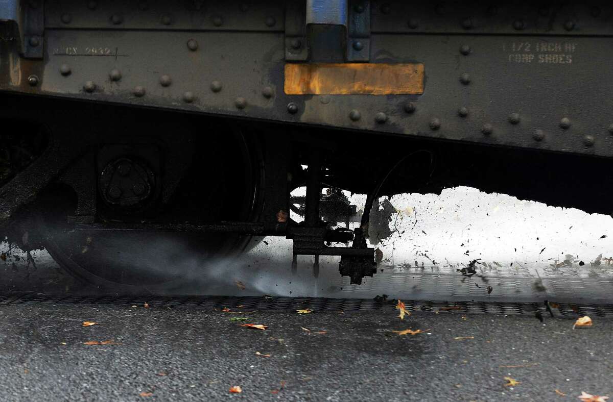 Due to an especially bad case of "slippery rail," Metro-North power washed the New Canaan Line's rails of slimy leaf residue on Tuesday, Nov. 13, 2012. The machine, called "Water World," is a switching locomotive followed by two 10,000-gallon tanker cars, followed by the washer/scrubber car which has a compressor and two high pressure nozzles that spray water at 10,000 pounds per square inch onto the top of the rails, followed by another locomotive.