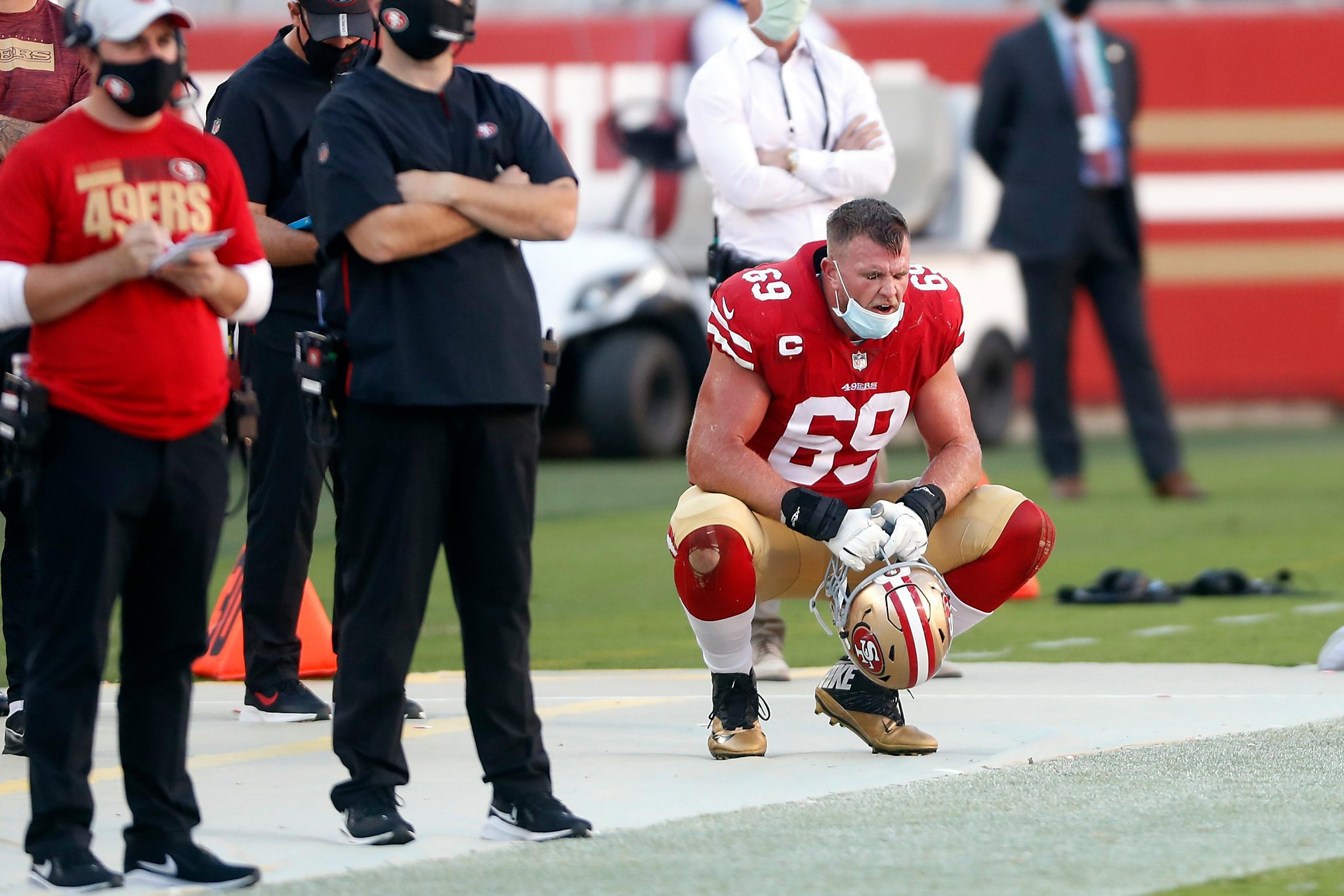 San Francisco 49ers Mike McGlinchey (69) is seen on the sideline during an  NFL football game against the Green Bay Packers, Sunday, Sept. 26, 2021, in  Santa Clara, Calif. (AP Photo/Scot Tucker