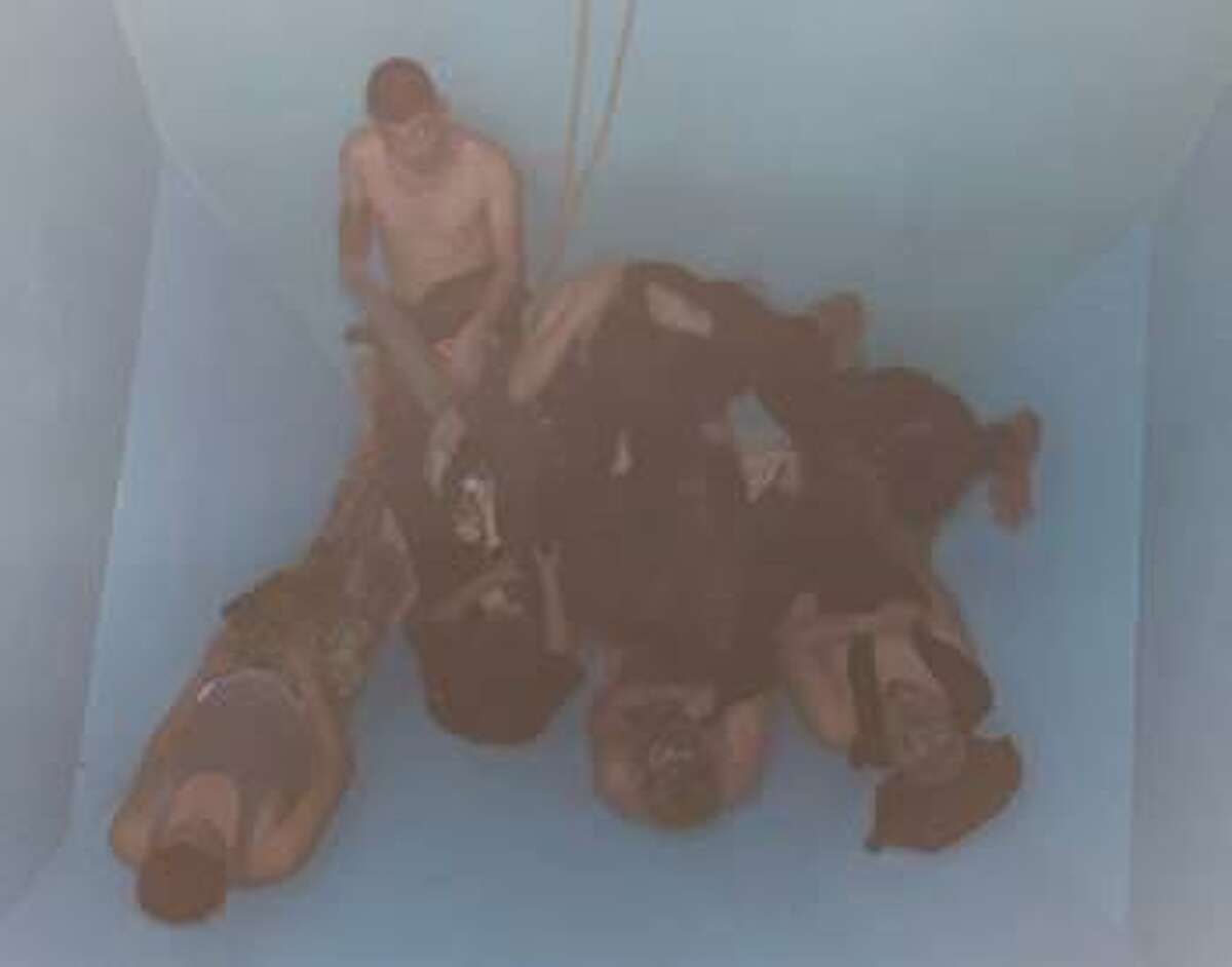 U.S. Border Patrol agents found this group of immigrants inside a grain hopper train car. Authorities said the immigrants had no means of escape.