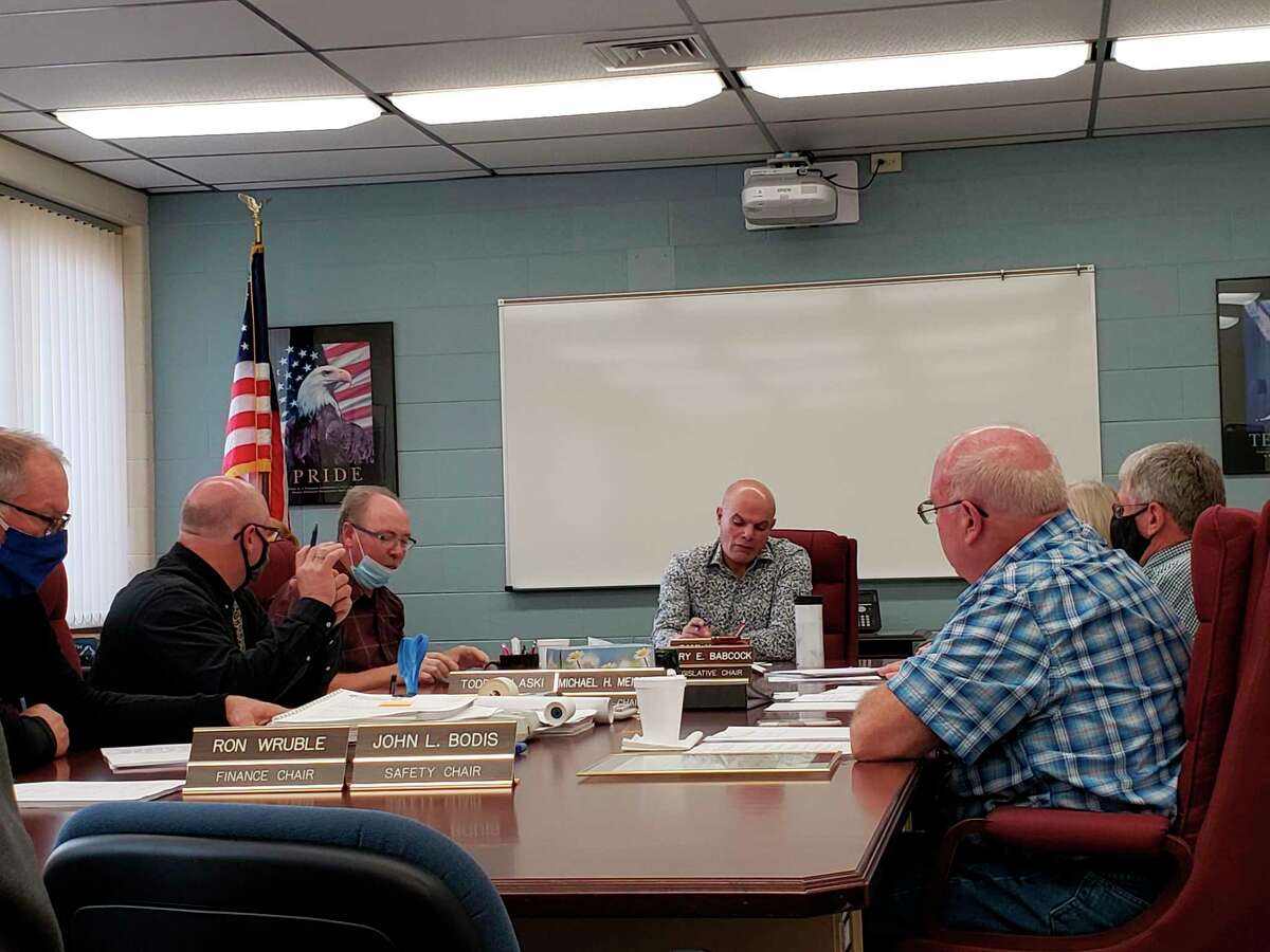 The county commissioners conduct their meeting earlier this week. (Robert Creenan/Huron Daily Tribune)