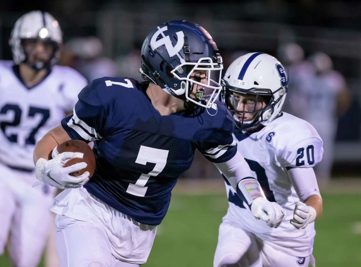 Wilton tight end Mike Coffey runs for extra yardage after making a catch in a game against Staples last year.