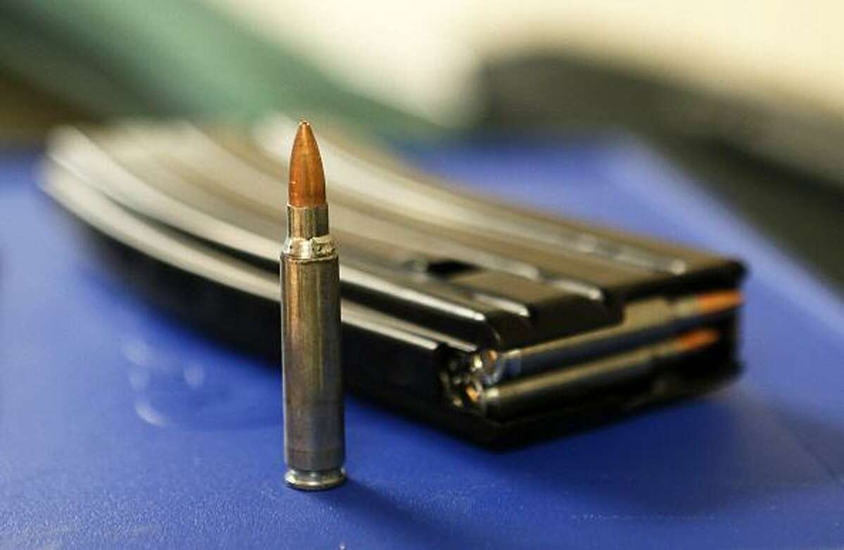 Shown is .223 AR-15 ammunition and a high capacity 30-round clip on a table at the “Get Some Guns & Ammo” shooting range on Jan. 15, 2013 in Salt Lake City, Utah.