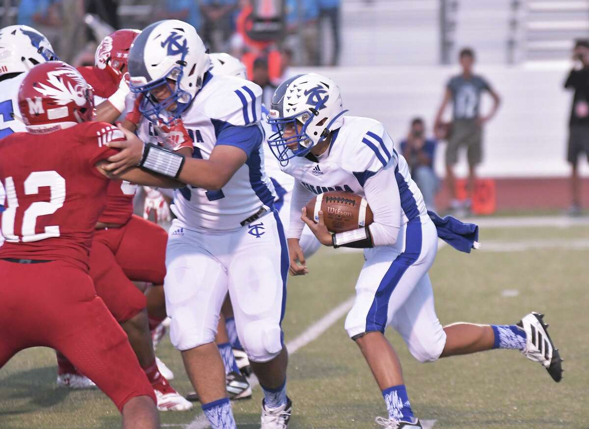Quarterback Hector Solis gets a block from his teammate as he carries the ball for the Cigarroa Toros against the Martin Tigers Friday, September 13, 2019 at Shirley Field.