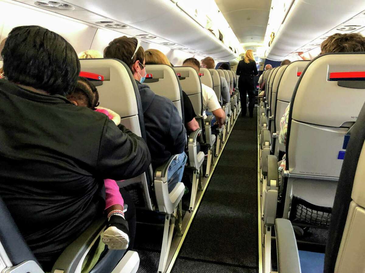 A flight from Bradley Airport to Chicago in May, on what a flight attendant said was one of the most crowded flights in two months.