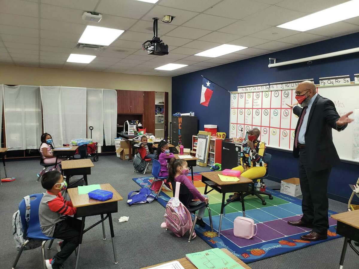 Fort Bend ISD superintendent Charles Dupre visits with students at Jones Elementary School on the first day of classes after schools re-opened.