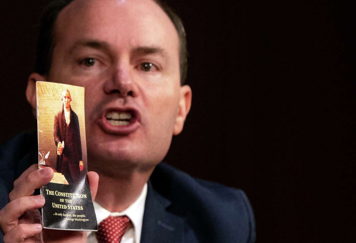 U.S. Sen. Mike Lee, R-Utah, holds up a copy of the U.S. Constitution during the Supreme Court confirmation hearing for Judge Amy Coney Barrett before the Senate Judiciary Committee on the first day of her hearing on Capitol Hill on Oct. 12, 2020 in Washington, D.C.