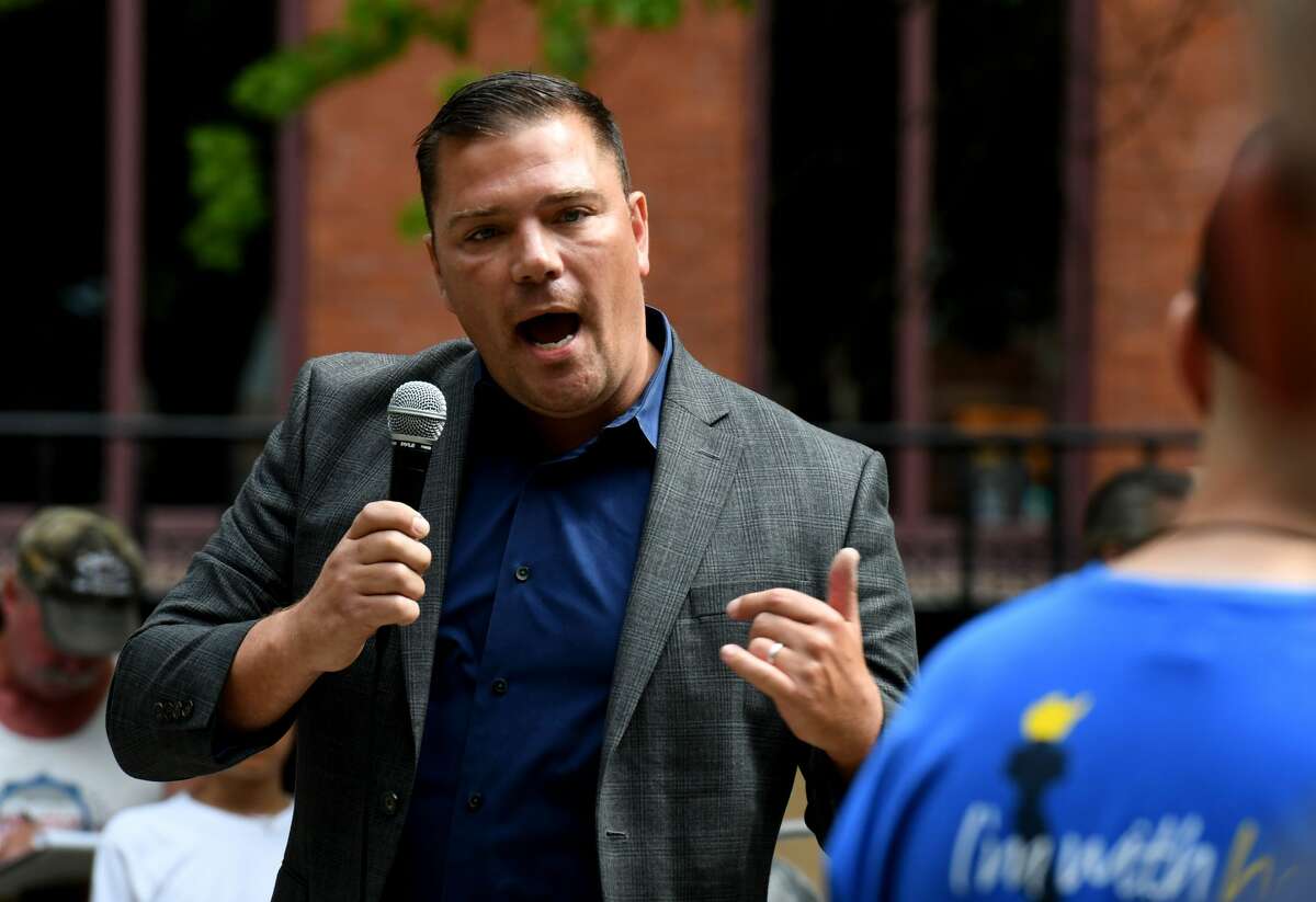Kyle Van De Water, Republican challenger in the 19th Congressional District race against Democrat incumbent Antonio Delgado, addresses protesters upset with Gov. Andrew Cuomo's governance during a rally at Academy Park on Monday Aug. 3, 2020, in Albany, N.Y. Among the issues being raised against the governor were; state response to the COVID19 crisis, state bail reform, defunding the police and the potential of mandatory COVID 19 shots. (Will Waldron/Times Union)