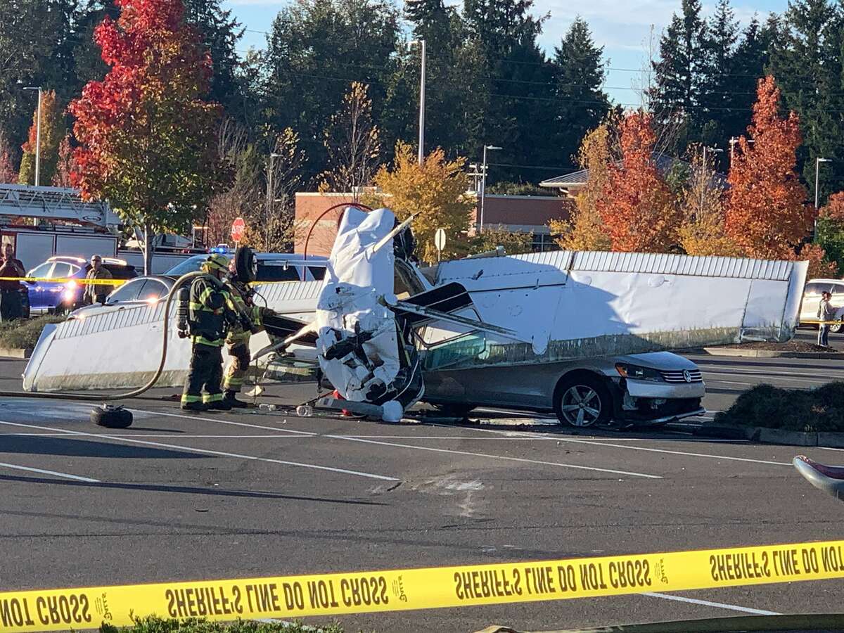 The scene after a small plane crashed in the parking lot of Pierce County strop shopping center.