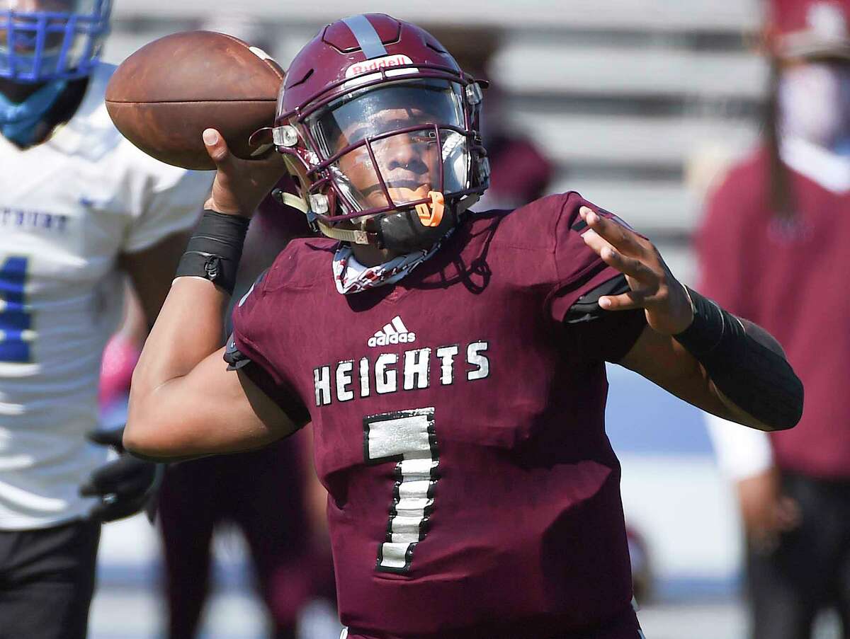 Heights quarterback Jalen Morrison (7) throws a pass during the first half of a high school football game against Westbury, Saturday, Oct. 10, 2020, in Houston.