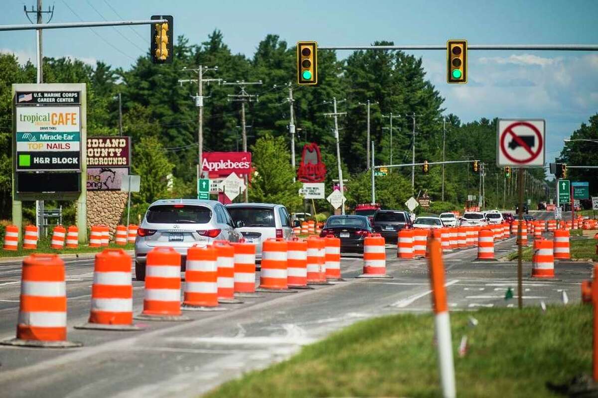 One lane of northbound traffic is blocked off as construction is underway along Eastman Avenue Thursday, Aug. 6, 2020 in Midland. (Katy Kildee/kkildee@mdn.net)