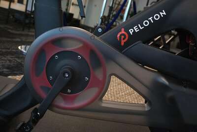 Peloton stock skids as company posts loss, cuts bike price