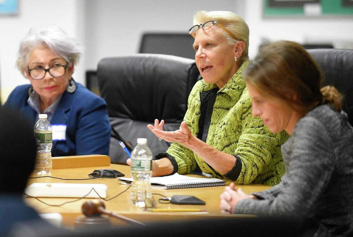 Rebecca Hamman, center, answers takes part in a forum hosted by the Parent-Teacher Council of Stamford at the Government Center in Stamford, Conn. on Oct. 10, 2019.