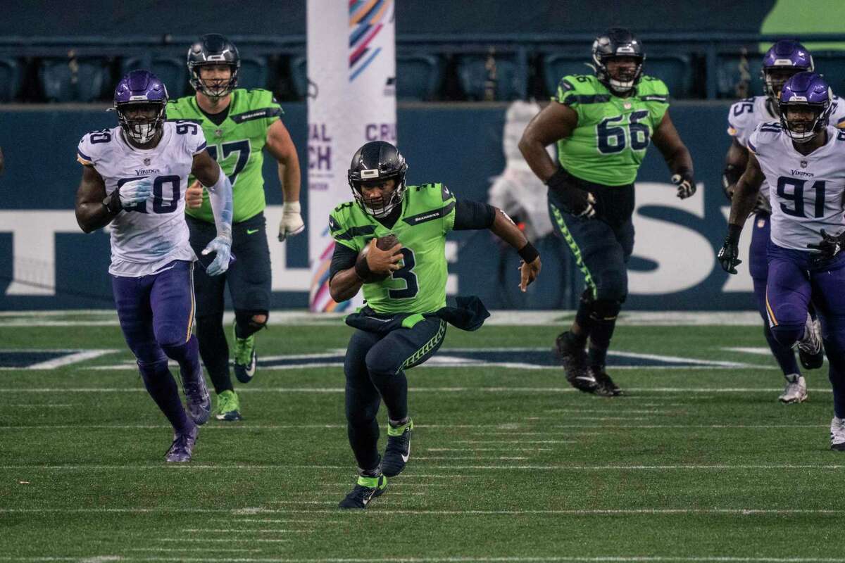 Seattle Seahawks quarterback Russell Wilson runs with the ball during the second half of an NFL football game against the Minnesota Vikings, Sunday, Oct. 11, 2020, in Seattle. Stamford-based NBC Sports’ “Sunday Night Football” finished No. 1 in the prime-time TV rankings for a record 10th-straight year.