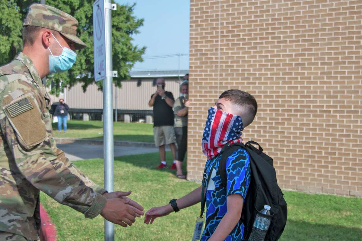 Cy Falls graduate Pct. Camden Handy surprises his younger brother Kyle at Horne Elementary in Cy-Fair ISD on Oct. 13, 2020.