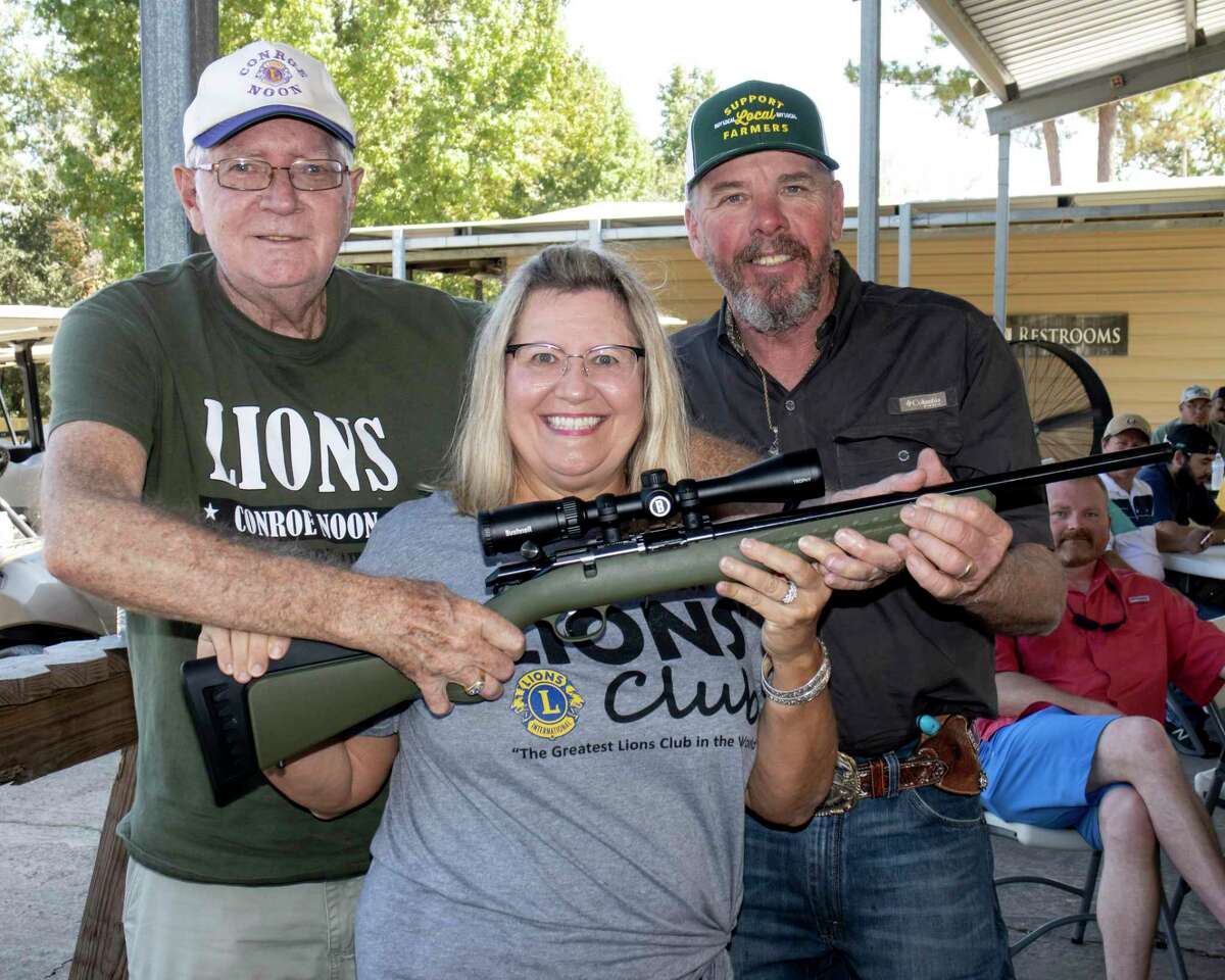 It was a bang up good time during the Conroe Noon Lions Club Clay Shoot last weekend as seen here during the Gun Raffle; pictured (l-r) Bob Gunter, Caroline McWilliams, Clyde Messer.