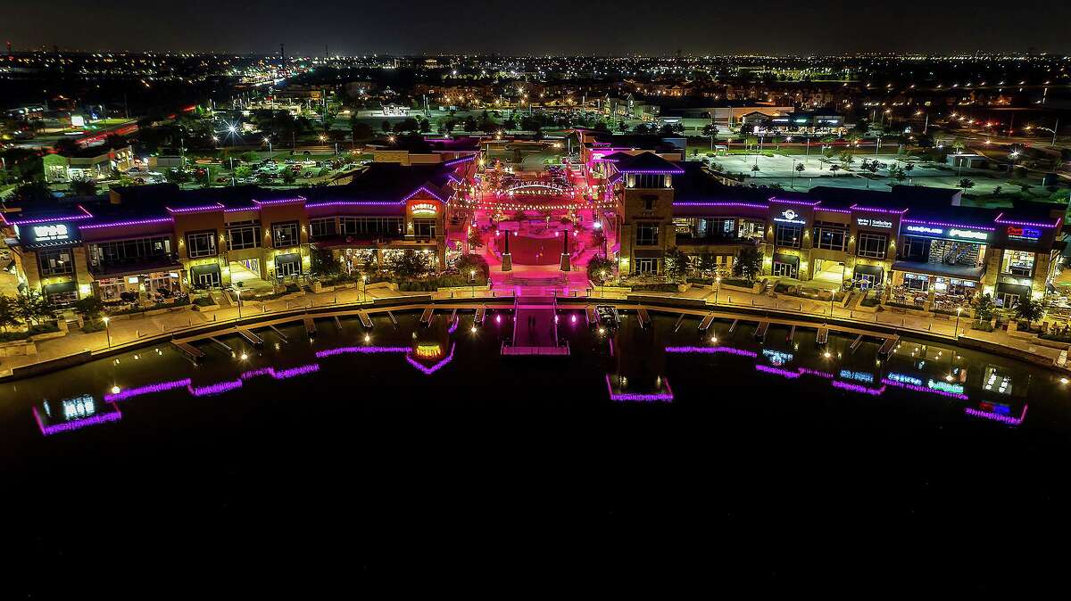 The Boardwalk at Towne Lake in northwest Houston is awash in pink with 2,000 lights recognizing Breast Cancer Awareness month this October. Every night of the month, from the rooftops to the green space area and bistro lights strung across the green, the lighting display sponsored by Houston Methodist shines a light on prevention, detection, and treatment.