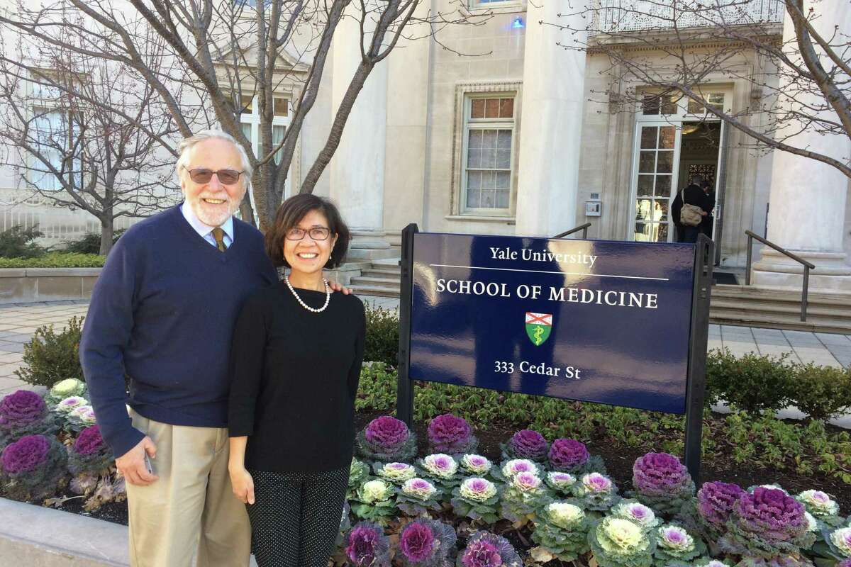 The Yale HIV/AIDS Program's current director, Dr. Merceditas Santos Villanueva, right, poses with her predecessor, Dr. Gerald Friedland, who headed the program from 1991 to 2010.