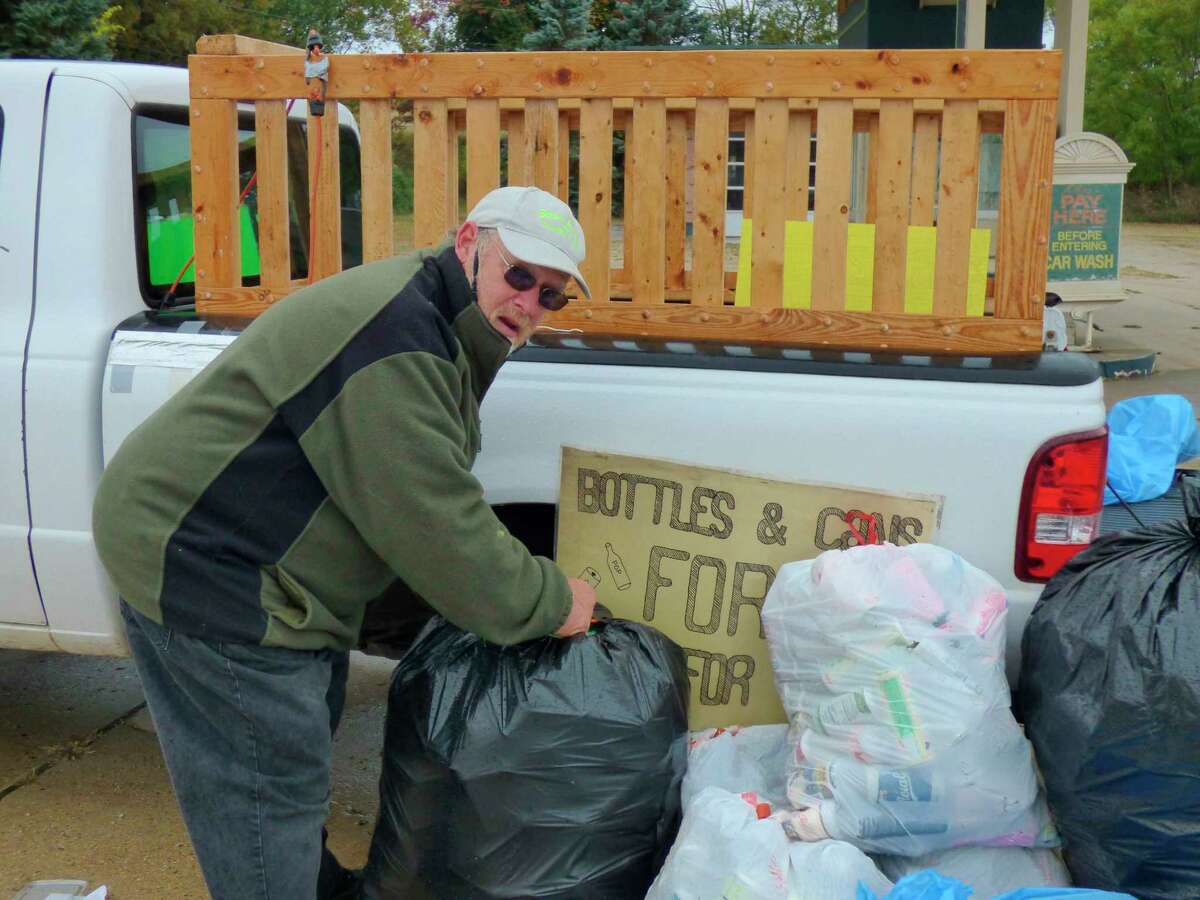 Kaleva resident, Timothy Dean gathers cans and bottles which he recycles into money for charity. (Scott Fraley/News Advocate)