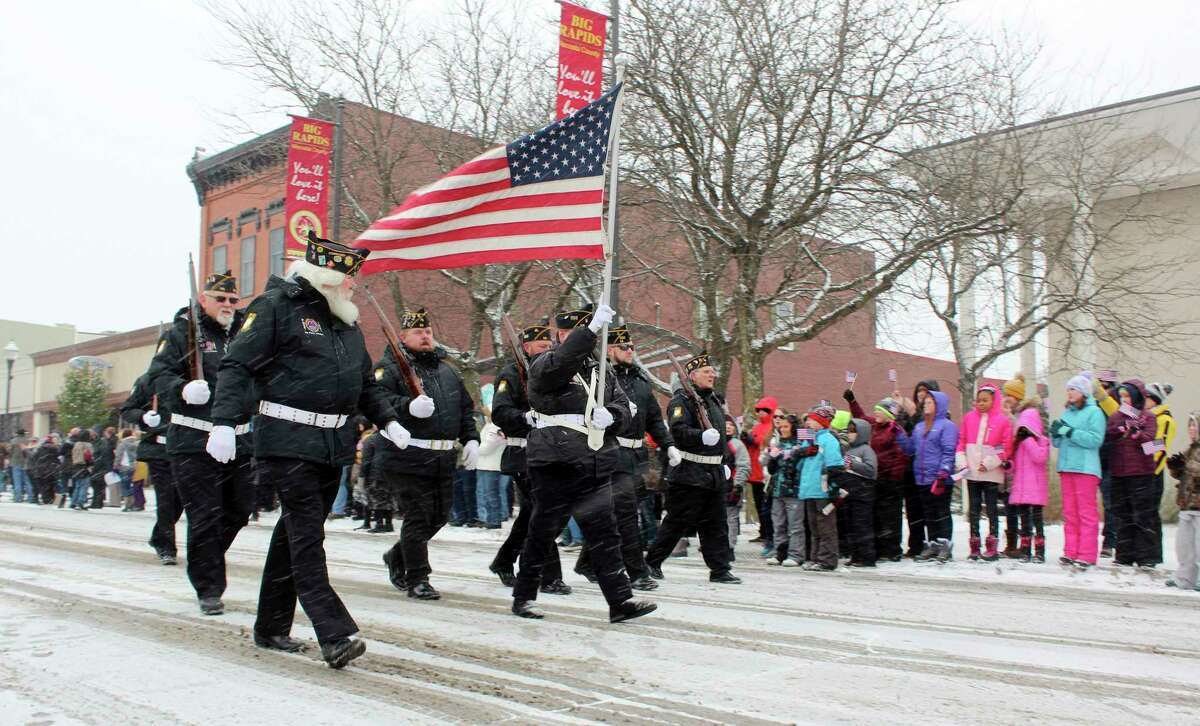 In this Nov. 11, 2019 Pioneer file photo, a group of veterans is pictured marching through downtown Big Rapids. Cold weather and snowy conditions didn't stop last year's Veterans Days parade from taking place, however, due to COVID-19 concerns, this year's parade has been cancelled. (Pioneer file photo)