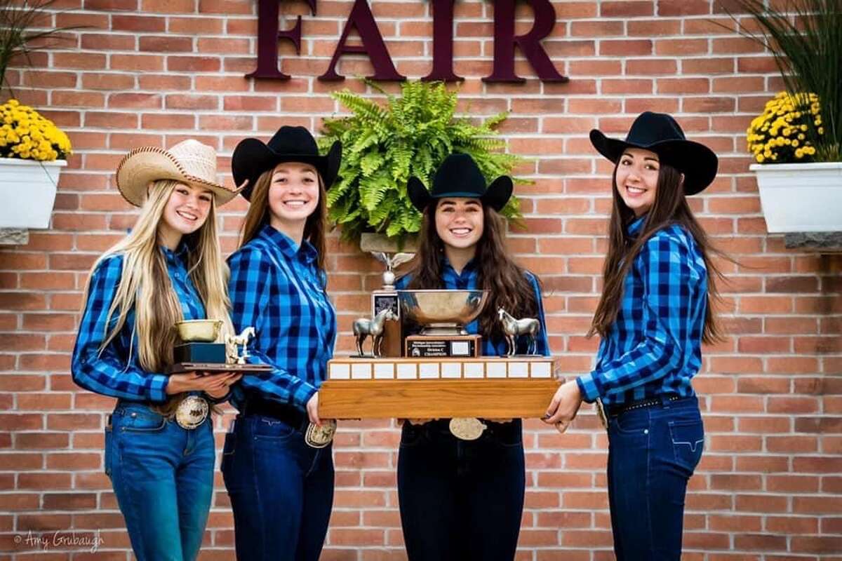 From left, Lola Smith, Morgan Glann, Jenna Holzinger, and Cammy Ankoviak make up the Meridian Early College High School equestrian team that won the Division C state championship on Sunday at the Michigan Interscholastic Horsemanship Association State Championship at the Midland County Fairgrounds.