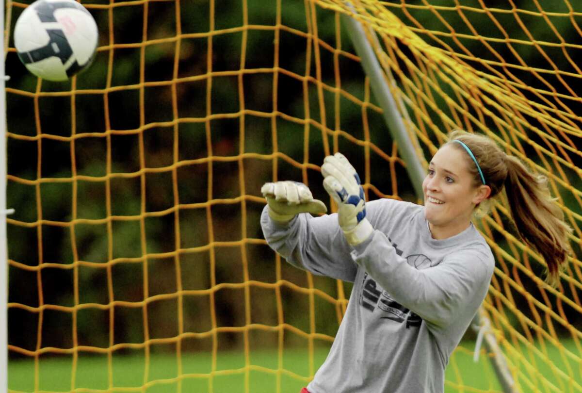 Guilderland High School girls soccer team goalie Erin Kelly, deflects a kick while in the net during practice on Tuesday, Oct. 27, 2009, in Guilderland, N.Y. The Dutchmen are gearing up for Class AA playoffs. HIGH SCHOOL SPORTS (Luanne M. Ferris / Times Union)