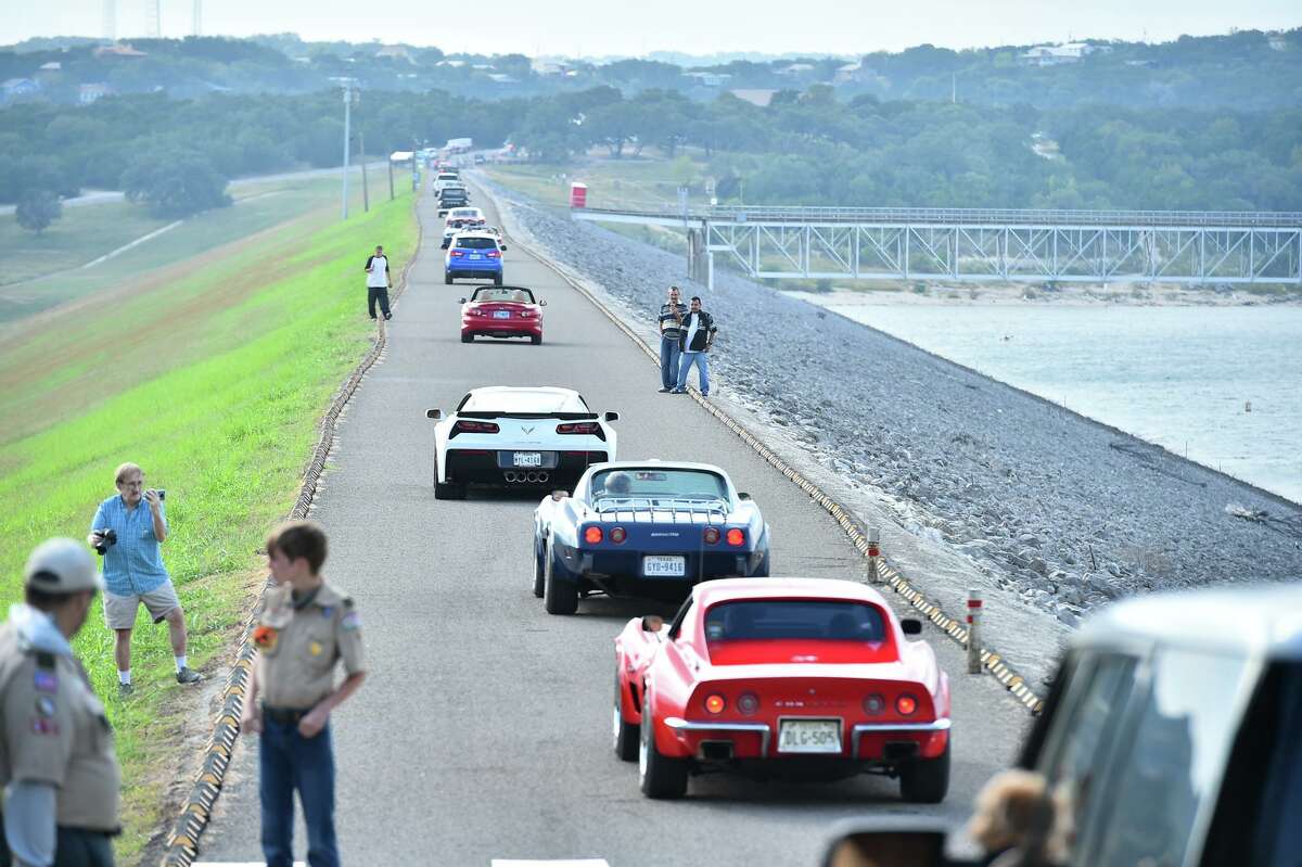 Cars drive across the Canyon Lake Dam on Sunday as part of the Canyon Lake Dam Community Alliance’s annual fundraiser. Hundreds of vehicles participated, traveling about 5 mph along the 1.3-mile structure, usually only open to pedestrians.
