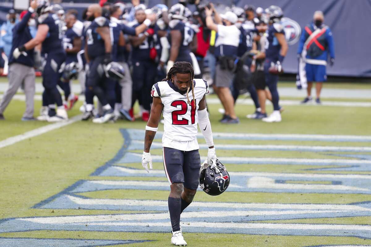 As Titans players celebrate behind him, the Texans’ Bradley Roby leaves the field. Tennessee tied it with a touchdown with four seconds left in regulation, then won with a TD in overtime.