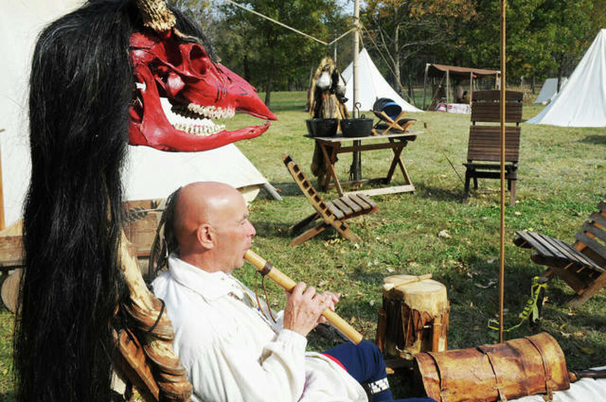 Scott Harris, of West Frankfort, demonstrates a Native American musical instrument during the Grafton Rendezvous Sunday.