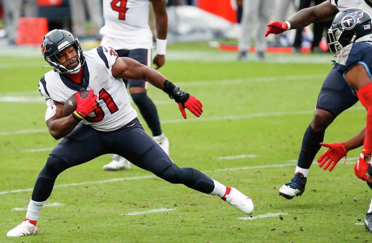 Houston Texans running back David Johnson (31) runs the ball against the Tennessee Titans during the third quarter of an NFL football game at Nissan Stadium on Sunday, Oct. 18, 2020, in Nashville.