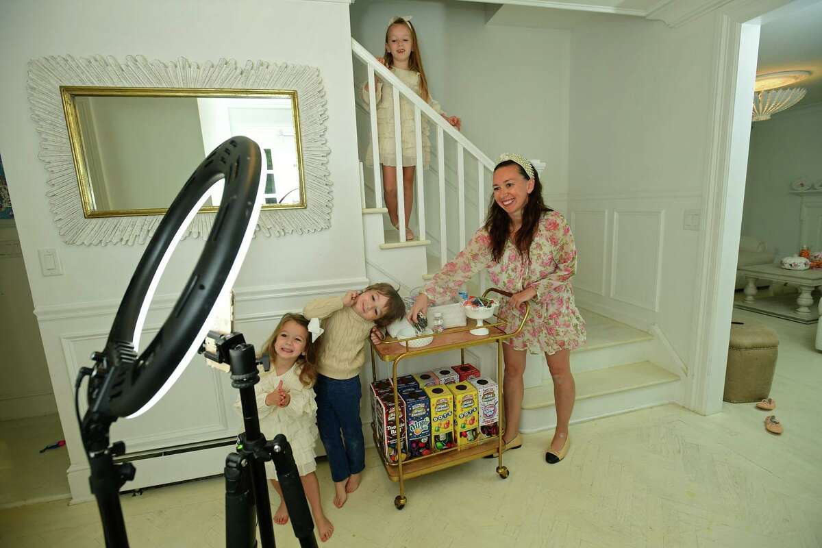Darien resident Shannon Doherty with her children, Leontine, 7, Colton, 5, and Fallon, 3, at their home Friday, October 16, 2020,in Darien, Conn. Doherty has become popular on TikTok with the sanitizing station she created for her children. She was recently featured on Good Morning America.