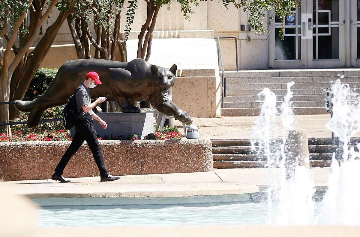 A student walks in front of the Ezekiel W. Cullen Building on UH main campus in Houston on Tuesday, Sept. 29, 2020.
