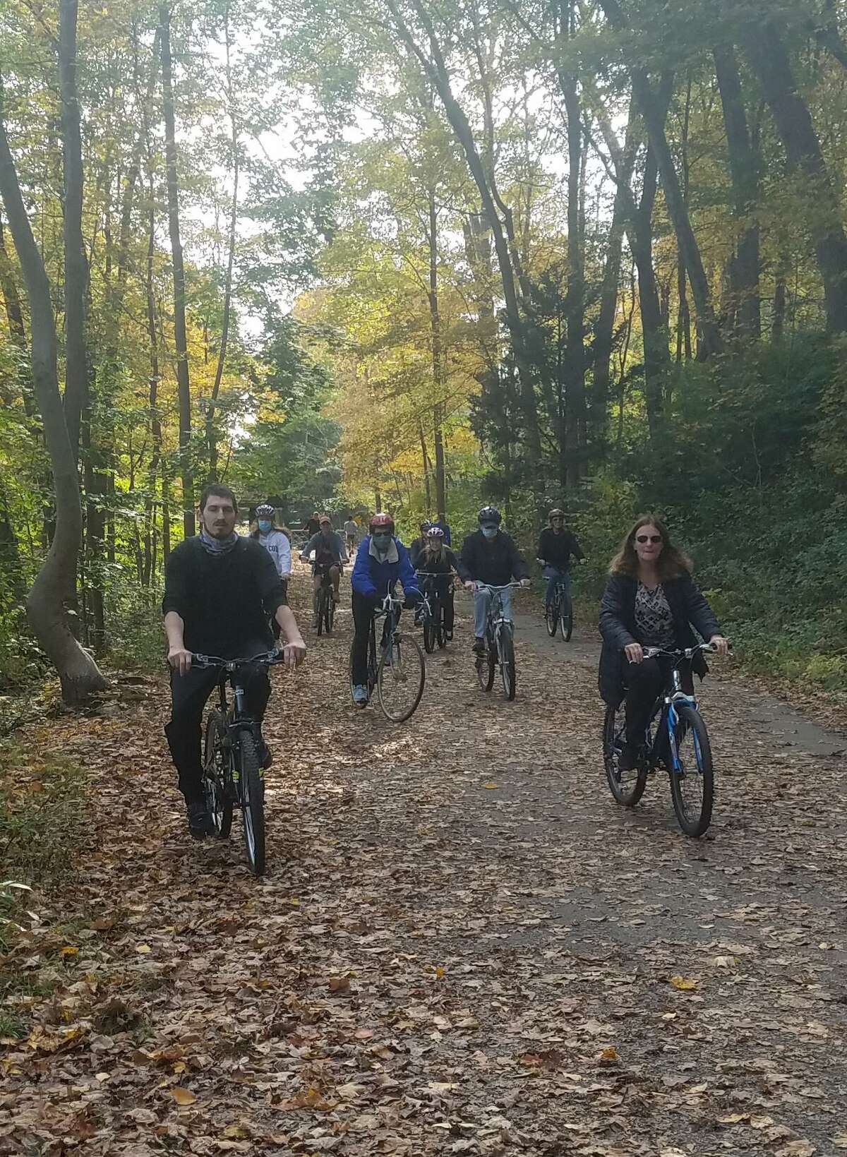 Local rail-trail historian/author, Sue A. DelBianco, pictured right/front in the bottom photo, brings a group of cyclists on a journey back in time to when train was king. She stopped off at many historical sites along the rail-trail in the Trumbull Valley on Sunday, Oct. 18. The site included a cow tunnel, site of a train wreck from 1901, remains of an ice house, a knit mill, an amusement park called Parlor Rock, two train stations and more. DelBianco tells the story of why the railroad vanished, and how it was turned into one of Connecticut's best recreational trails. Another historical bike tour is planned for May, 2021, which will be announced in The Trumbull Times.