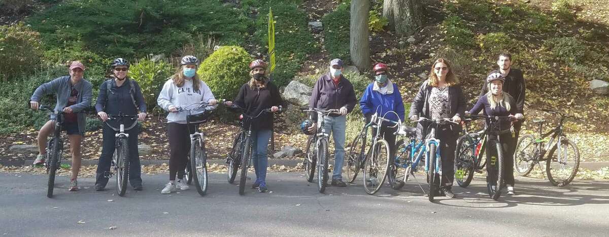 Local rail-trail historian/author, Sue A. DelBianco, pictured right/front in the bottom photo, brings a group of cyclists on a journey back in time to when train was king. She stopped off at many historical sites along the rail-trail in the Trumbull Valley on Sunday, Oct. 18. The site included a cow tunnel, site of a train wreck from 1901, remains of an ice house, a knit mill, an amusement park called Parlor Rock, two train stations and more. DelBianco tells the story of why the railroad vanished, and how it was turned into one of Connecticut's best recreational trails. Another historical bike tour is planned for May, 2021, which will be announced in The Trumbull Times.