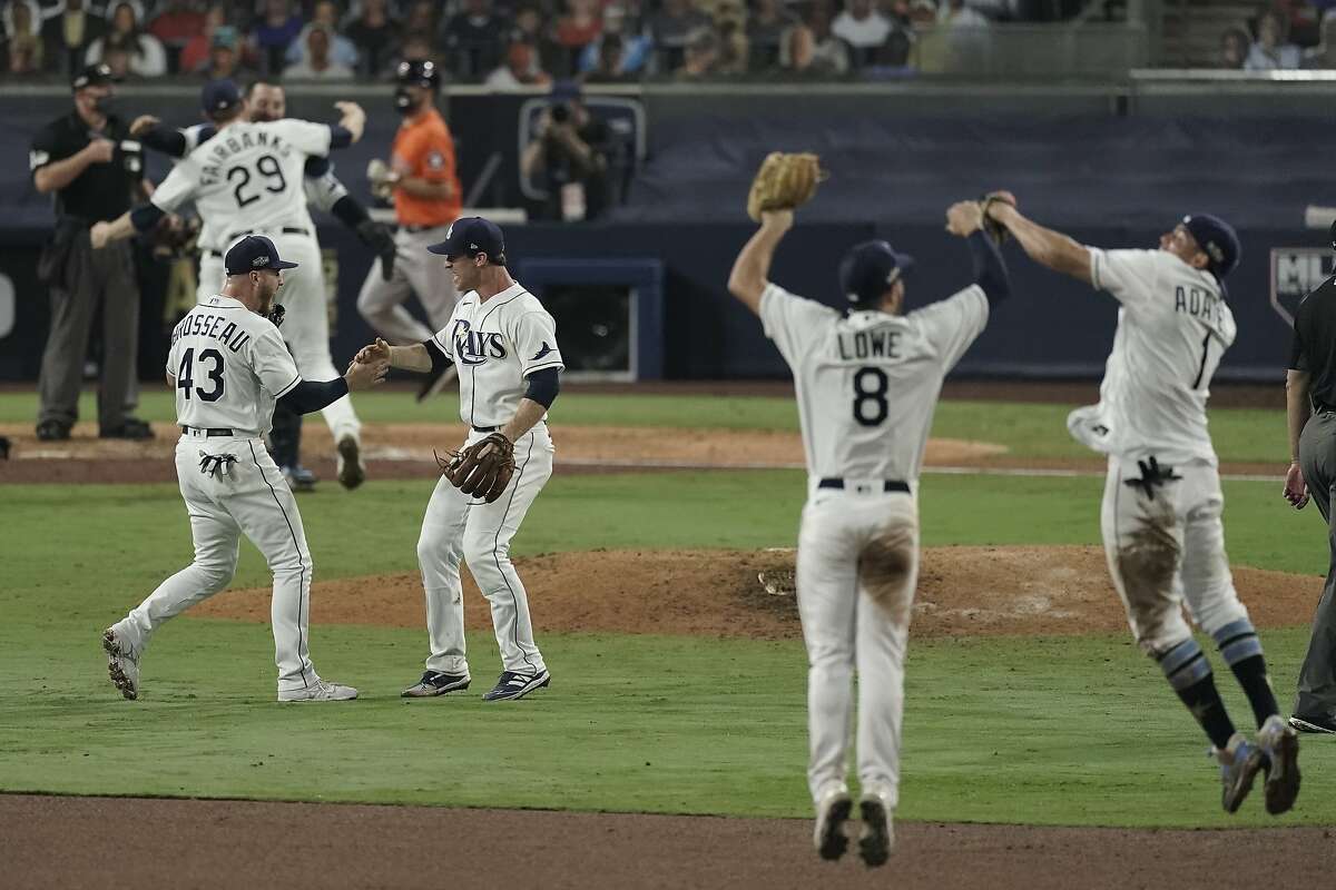 Tampa Bay Rays celebrate their victory against the Houston Astros in Game 7 of a baseball American League Championship Series, Saturday, Oct. 17, 2020, in San Diego. The Rays defeated the Astros 4-2 to win the series 4-3 games.