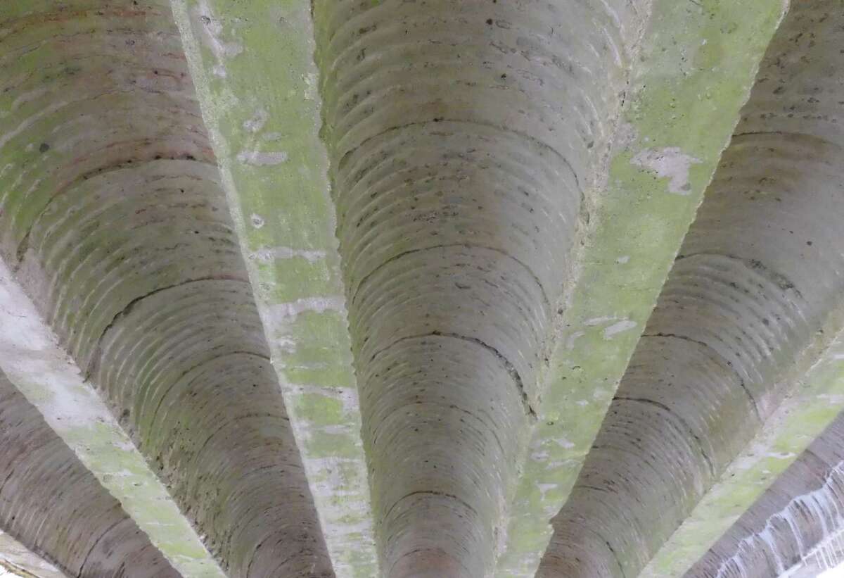 The underside of the Lovers Lane bridge over the Comstock Brook.