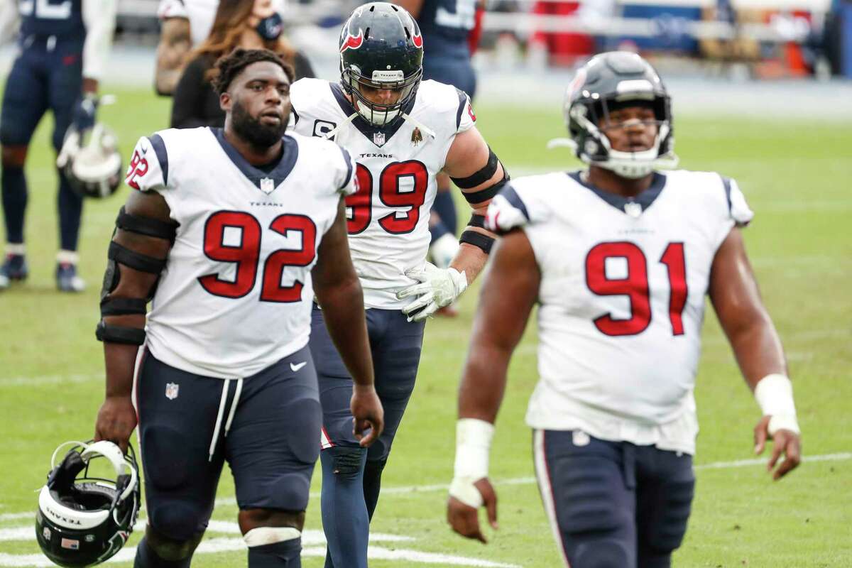 The Texans have primarily used a three-man front on defense this season. J.J. Watt, Brandon Dunn and Carlos Watkins walk off the field after loss to Tennessee in October.