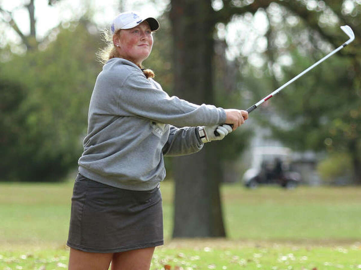 Marquette Catholic’s Gracie Piar watches her second shot on the 18th hole just miss the green in last week’s Class 1A sectional at Salem Country Club. Piar bogeyed the hole to finish at 72.