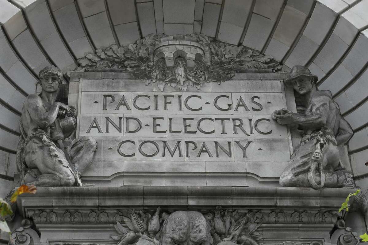 In this April 16, 2020, file photo, a Pacific Gas & Electric sign is displayed on the exterior of a PG&E building in San Francisco. When Pacific Gas & Electric set up emergency operations centers to coordinate intentional blackouts intended to prevent wildfires in Northern California, the nation's largest utility forgot one thing, emergency managers who knew the fundamentals of emergency management in California.