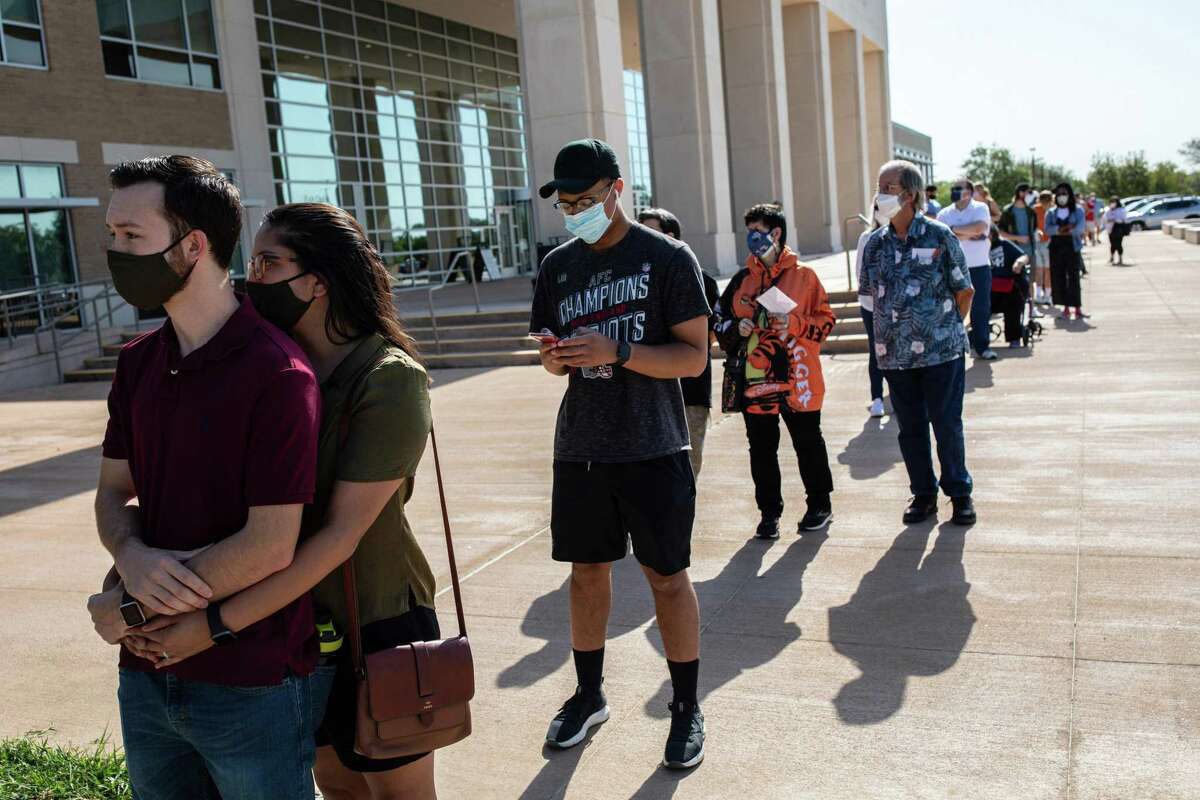 People line up for early voting at the Hays County Government Center in San Marcos last week. Get out there and vote, people.
