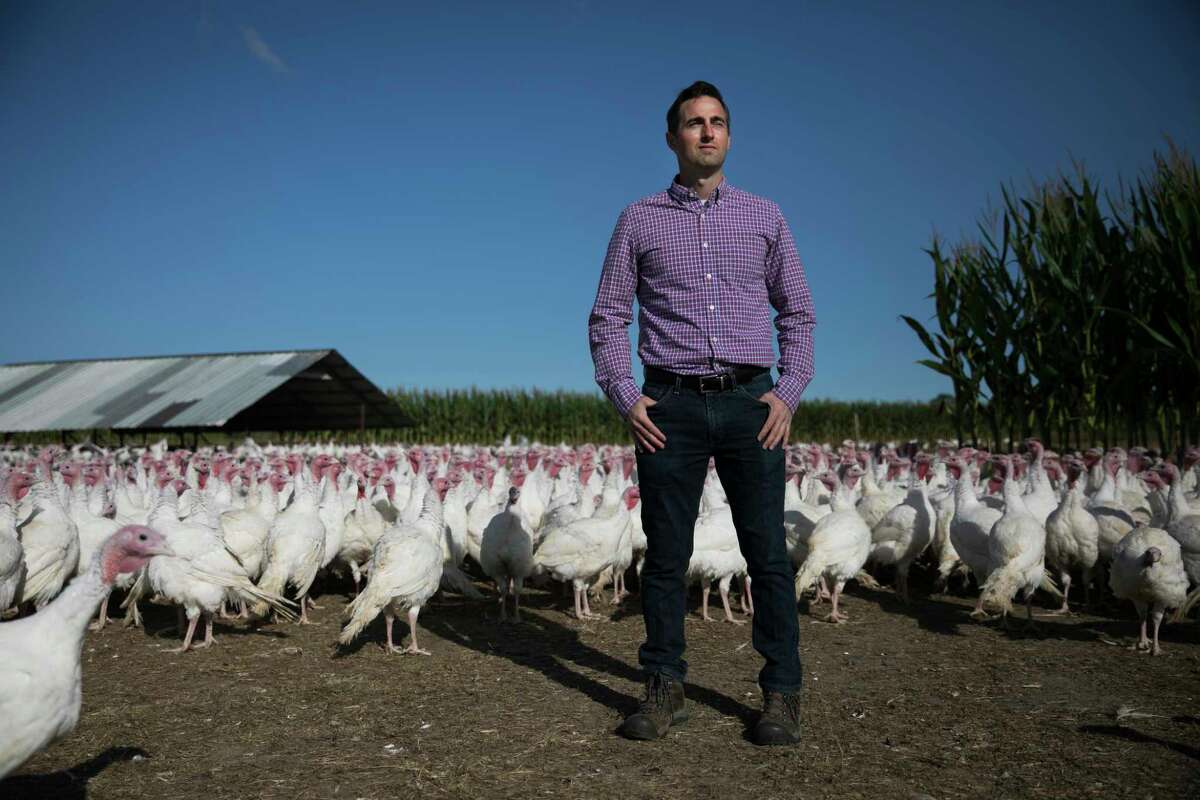 "There are a lot of unknowns for us right now," says Drew Bowman, shown on his New Carlisle, Ohio, turkey farm in September.