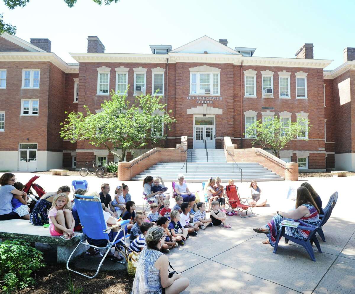 Story time reading session led by Old Greenwich School Principal Jennifer Bencivengo in front of the school for incoming students at the Old Greenwich School, Greenwich, Conn., Thursday, August 23, 2018.